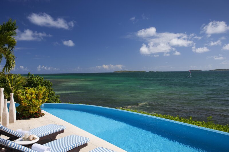 Infinity Pool Overlooking Ocean — Blue, Serene, Afternoon, Photograph, Sailboat