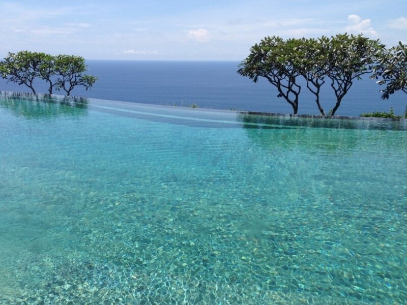 Infinity Pool Overlooking Ocean — Blue, Serene, Afternoon, Photograph, Trees
