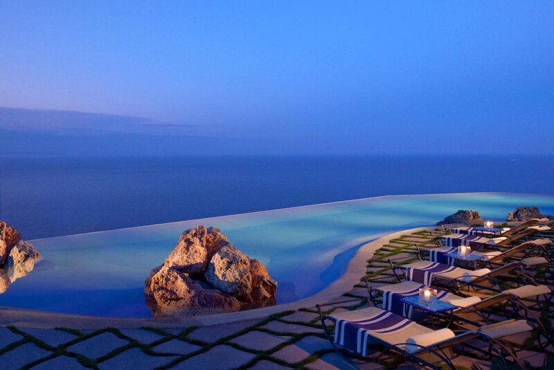Infinity Pool Overlooking Ocean — Blue, Serene, Sunset, Photograph, Lounge Chairs
