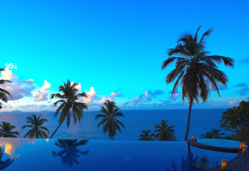 Infinity Pool Overlooking Ocean — Blue, Serene, Sunset, Photograph, Palm Trees, Sky