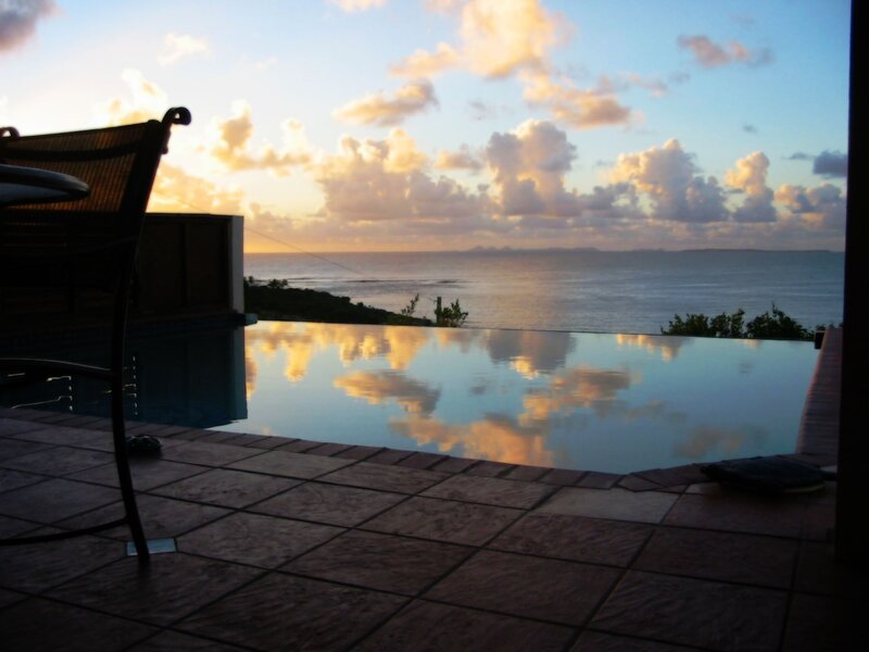 Infinity Pool Overlooking Ocean — Blue, Serene, Sunset, Photograph, Sky