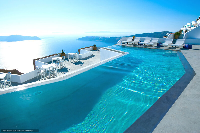 Infinity Pool Overlooking Sea — Blue, Serene, Afternoon, Photograph, Chairs, Buildings