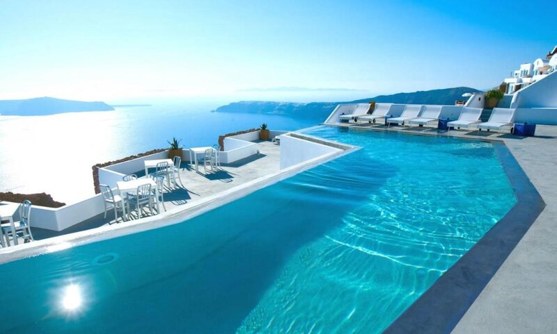 Infinity Pool Overlooking Sea — Blue, Serene, Afternoon, Photograph, Lounge Chairs, Ocean