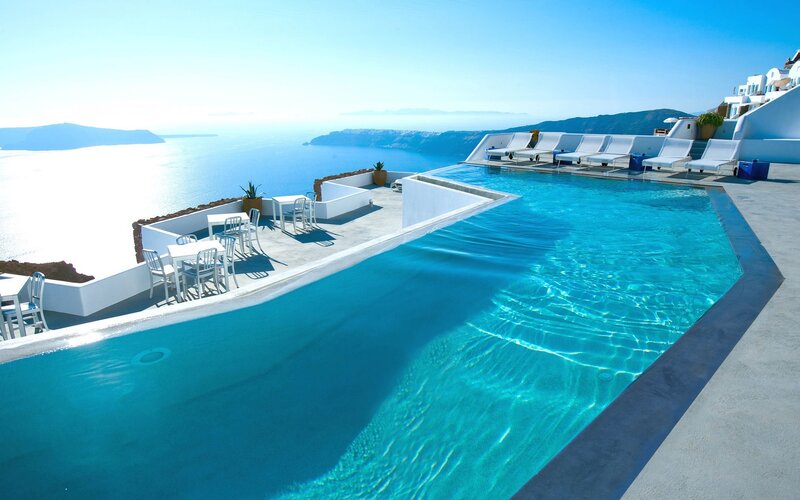 Infinity Pool Overlooking Sea — Blue, Serene, Afternoon, Photograph, Lounge Chairs, Tables, Ocean
