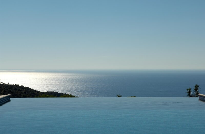 Infinity Pool Overlooking Sea — Blue, Serene, Afternoon, Photograph, Sky