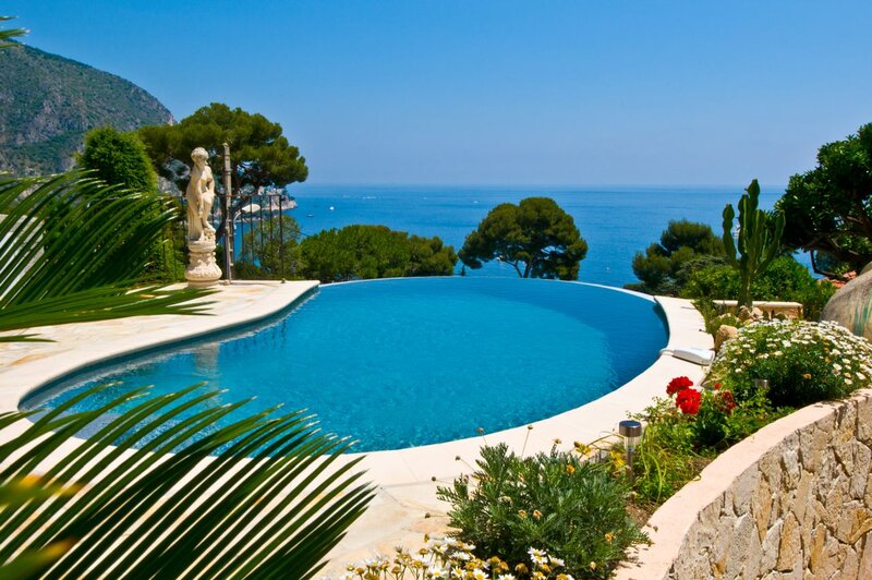 Infinity Pool Overlooking Sea — Blue, Serene, Afternoon, Photograph, Statue