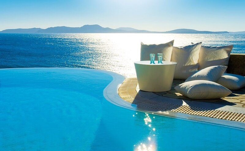 Infinity Pool Overlooking Sea — Blue, Serene, Afternoon