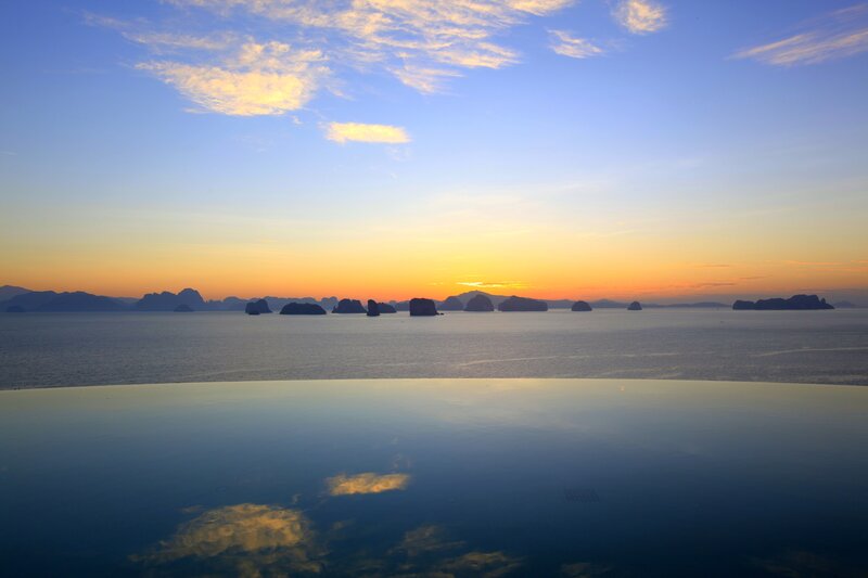 Infinity Pool Overlooking Sea — Blue, Serene, Sunset, Photograph, Islands