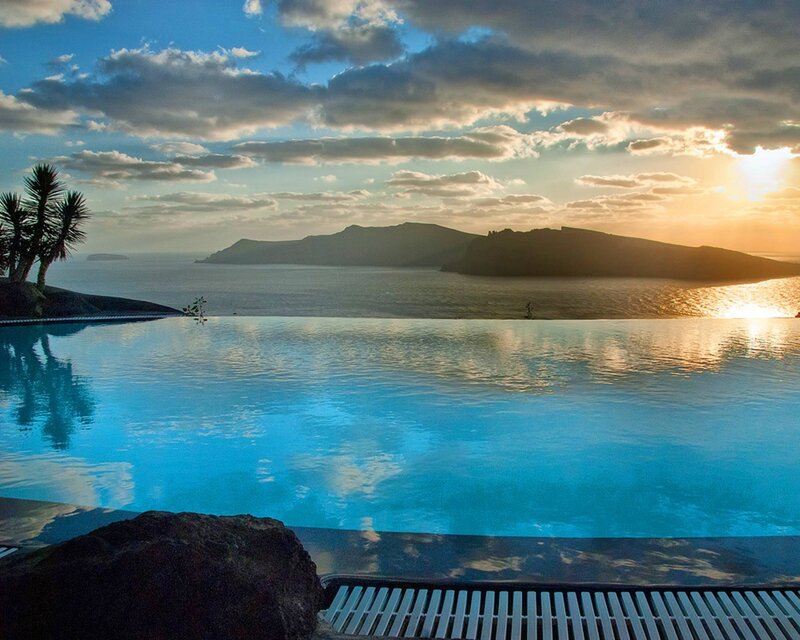 Infinity Pool Overlooking Sea — Blue, Serene, Sunset, Photograph, Palm Trees