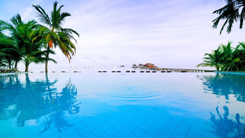 Infinity pool overlooking tropical island
