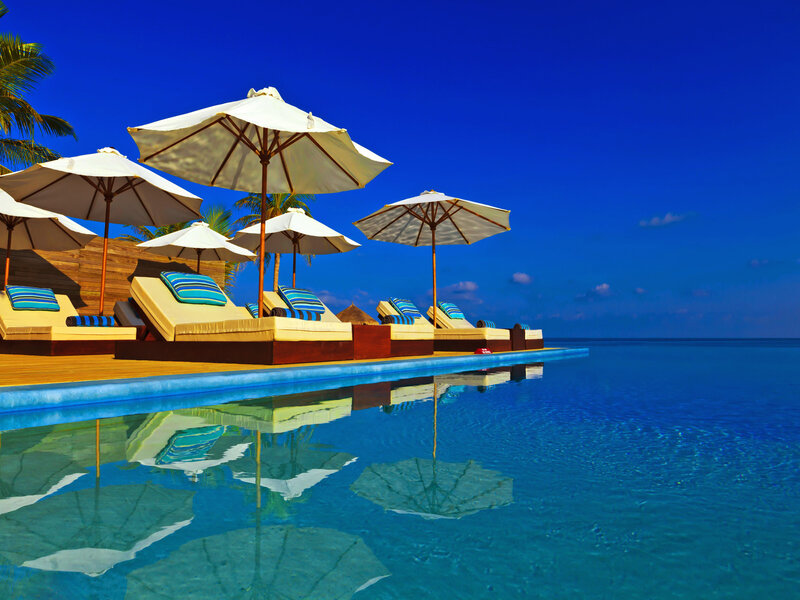 Infinity Pool with Lounge Chairs — Blue, Serene, Afternoon, Photograph