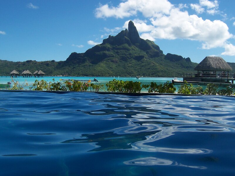 Infinity Pool with Mountain View — Blue, Serene, Afternoon