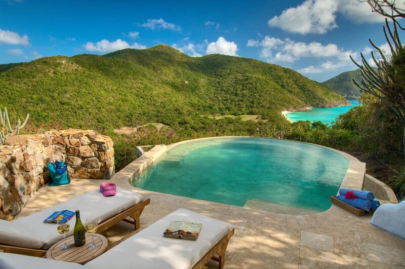Infinity Pool with Ocean View — Blue, Serene, Afternoon, Photograph, Lounge Chairs, Stone Wall