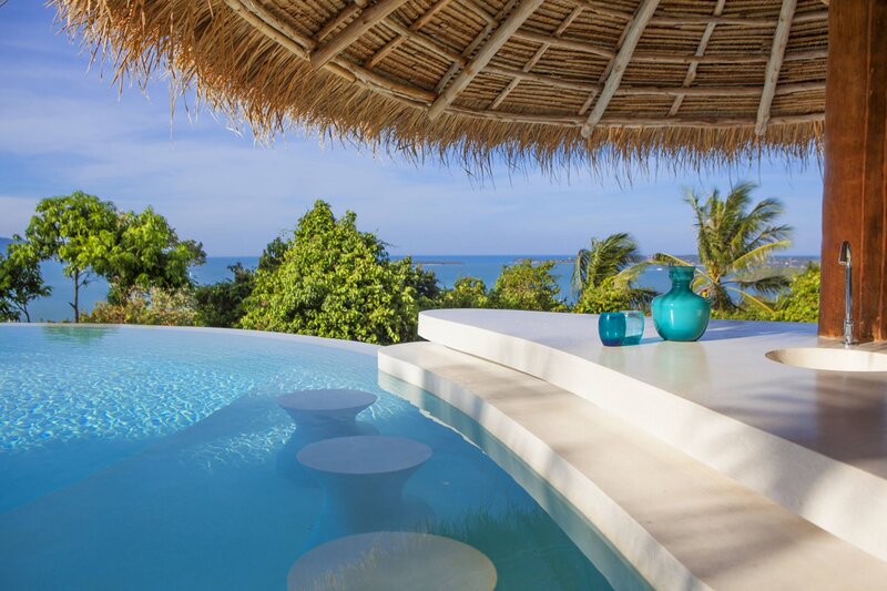 Infinity Pool with Ocean View — Blue, Serene, Afternoon, Photograph, Thatched Roof
