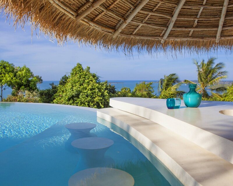 Infinity Pool with Ocean View — Blue, Serene, Afternoon, Photograph, Thatched Roof, Vases