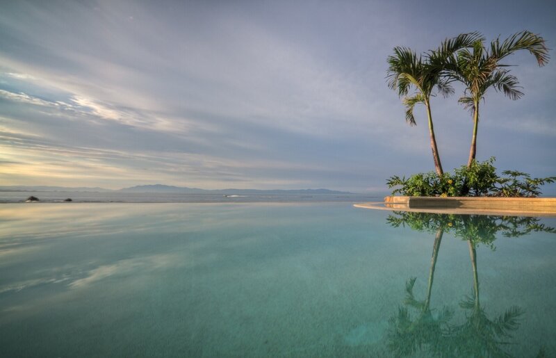 Infinity Pool with Palm Trees — Blue, Serene, Sunset