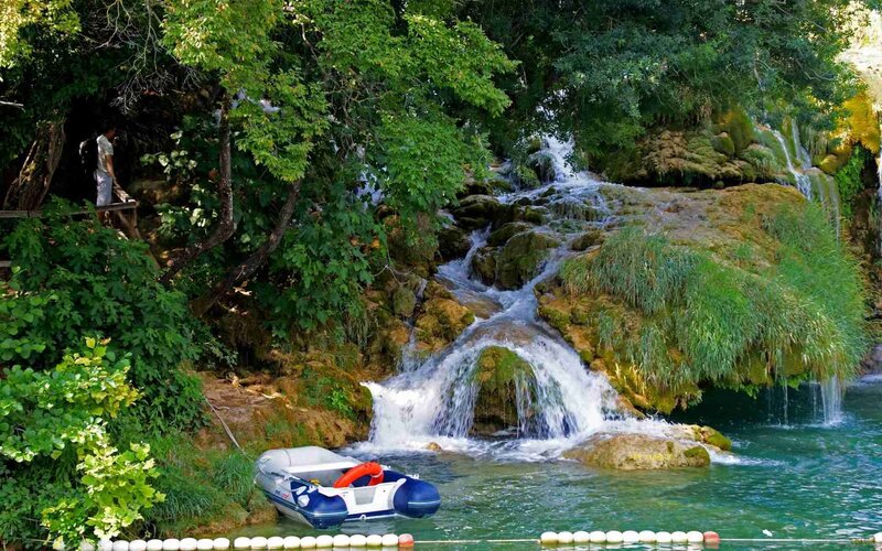 Inflatable Boat at Waterfall — Green