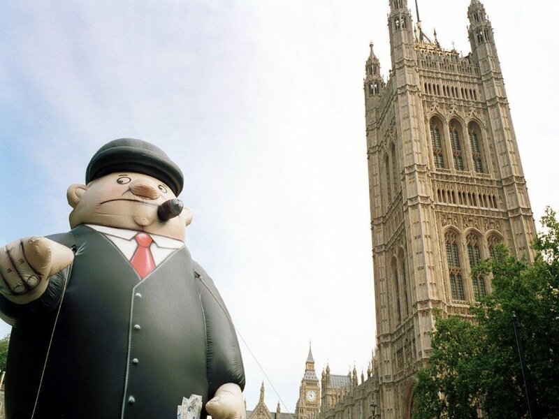 Inflatable figure in front of Big Ben