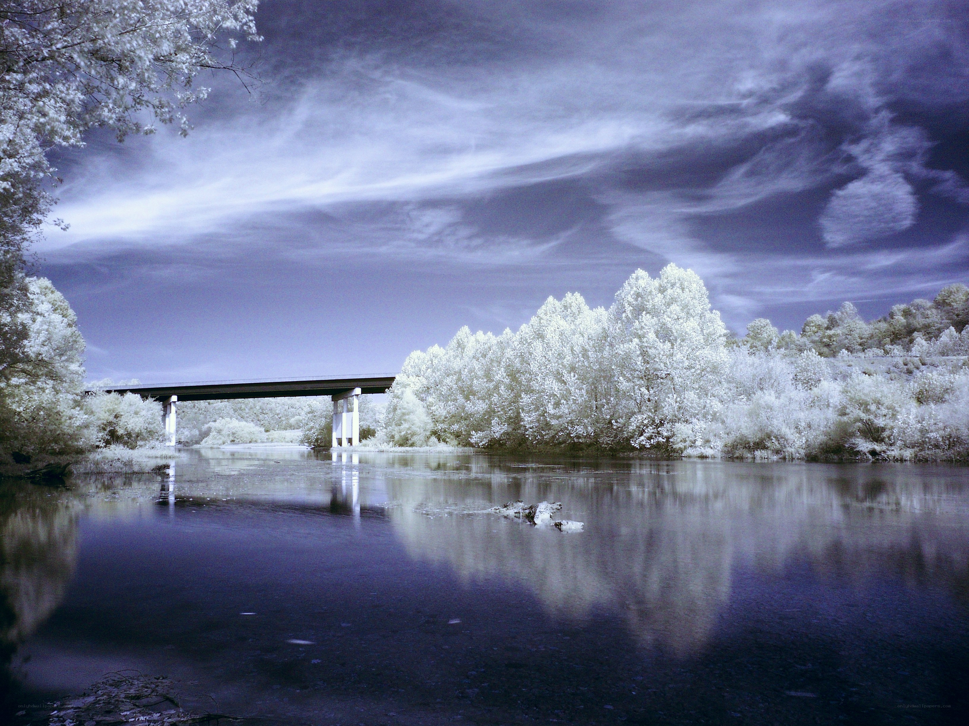 Infrared river landscape with bridge