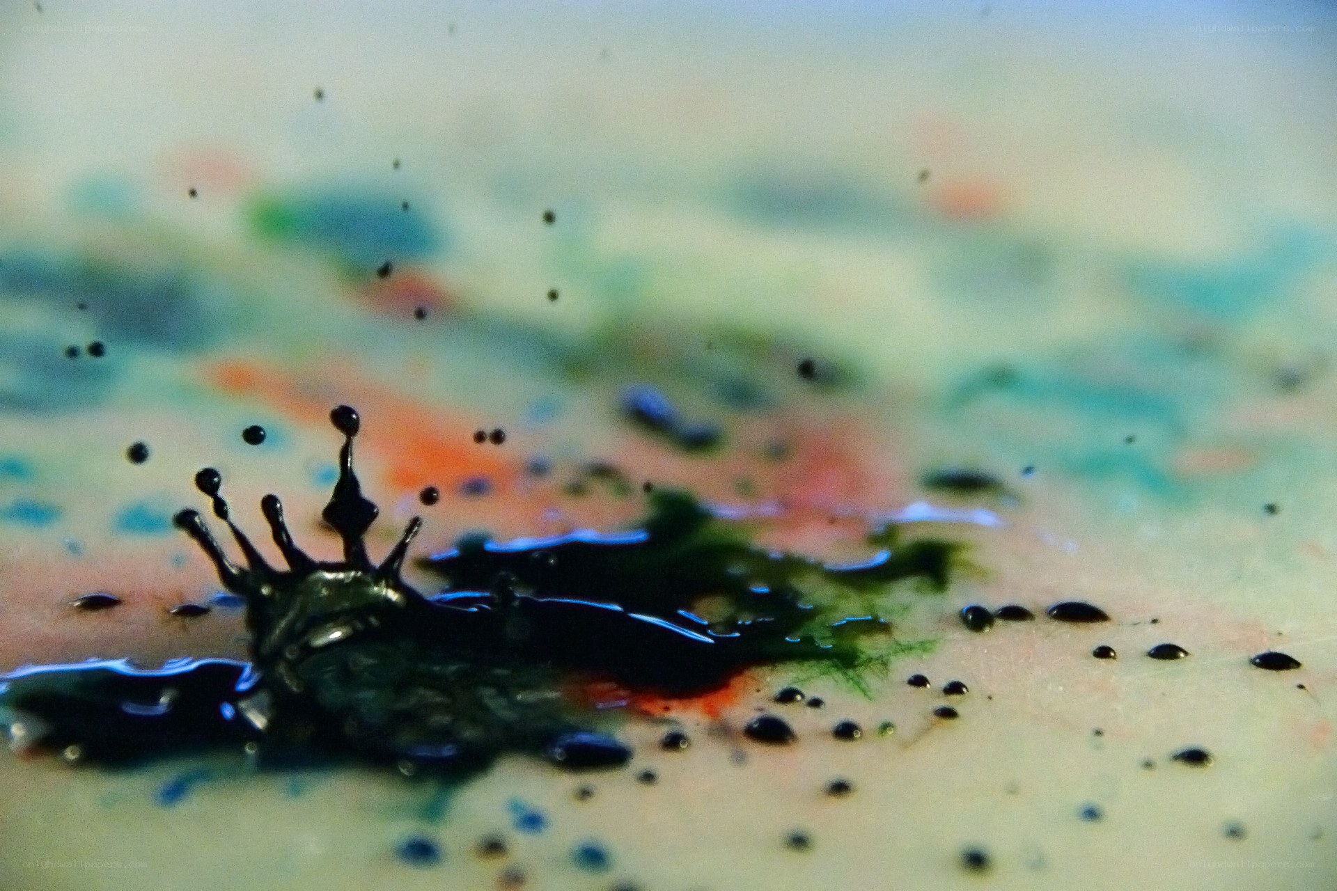 ink drop splash on colorful surface