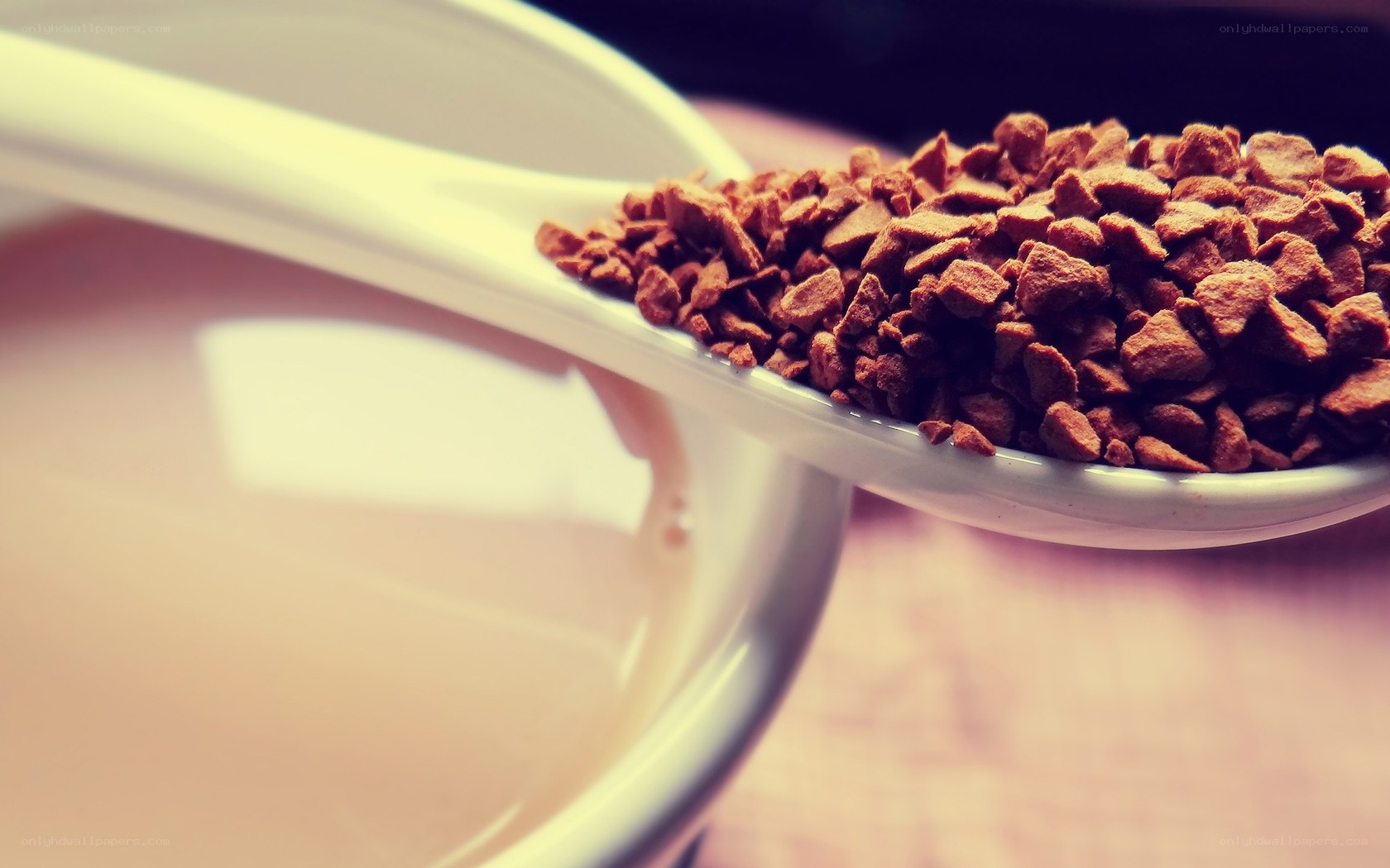 instant coffee granules on spoon