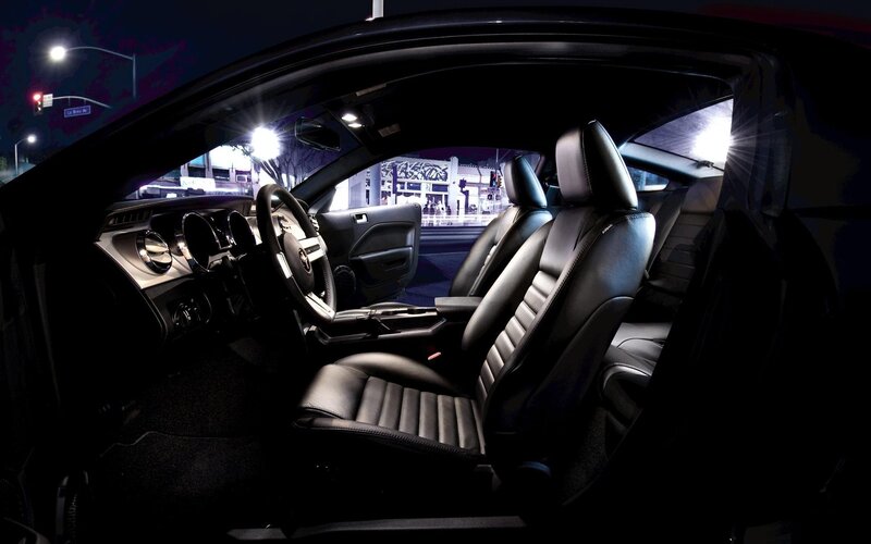 Interior of a black car at night