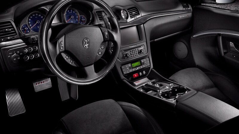 Interior of a Car — Black, Sleek, Photograph, Steering Wheel, Dashboard, Center Console