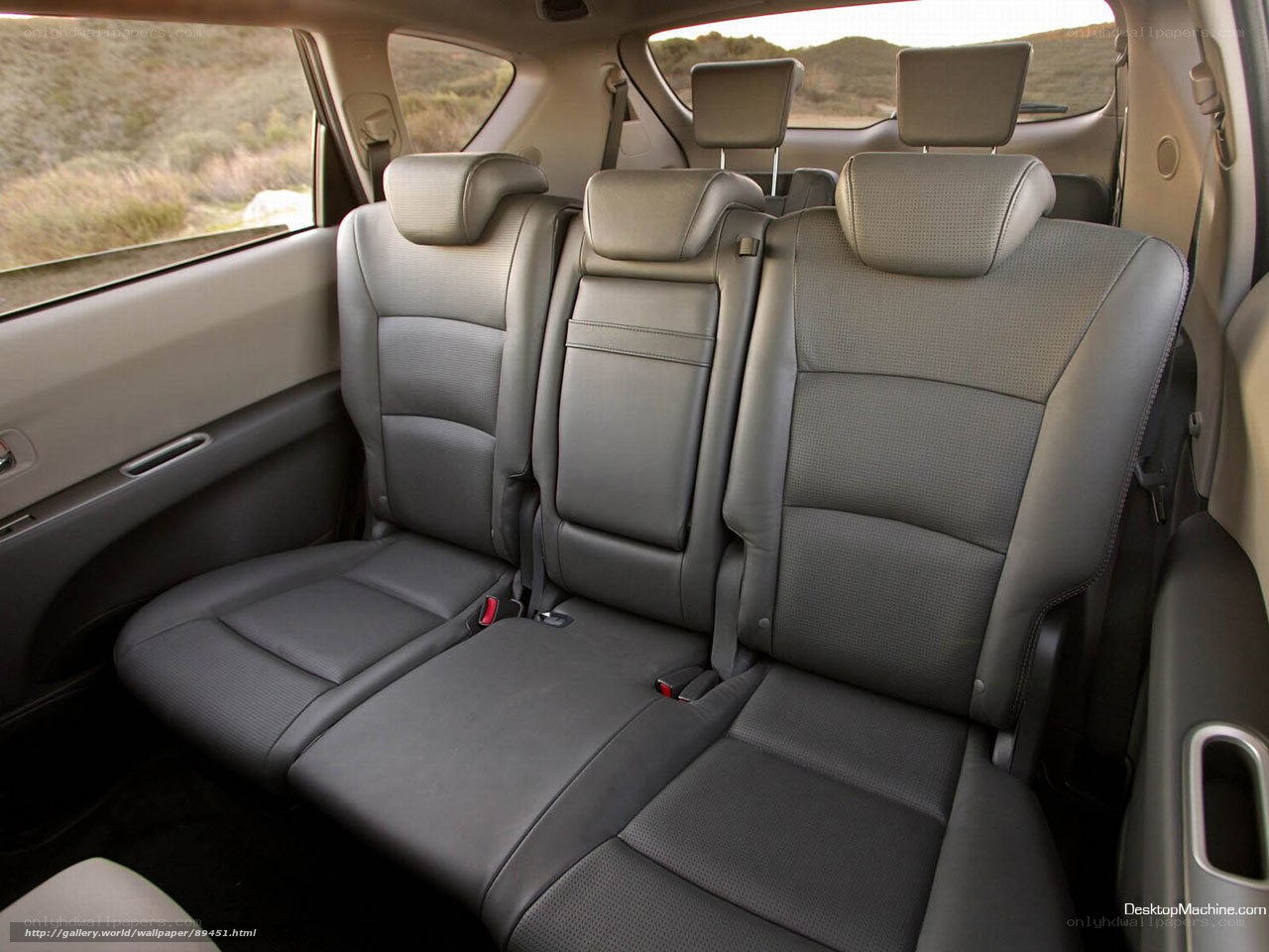 Interior of a car with three rear seats