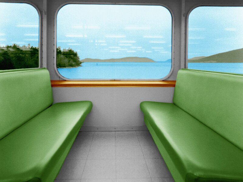 Interior of a ferry with green seats