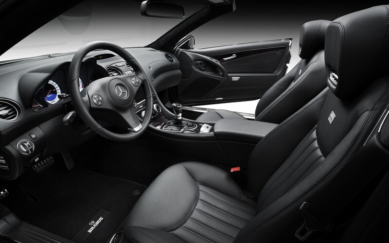 Interior of a Luxury Car — Black, Sleek, Photograph, Steering Wheel, Center Console, Leather Seats