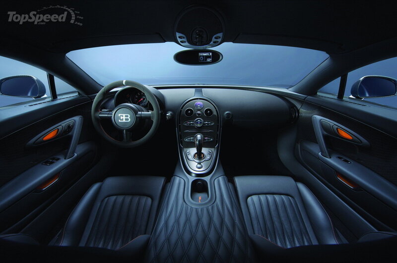 Interior of a Luxury Car — Black, Sophisticated, Photograph, Steering Wheel, Center Console