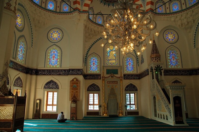 Interior of a mosque with stained glass