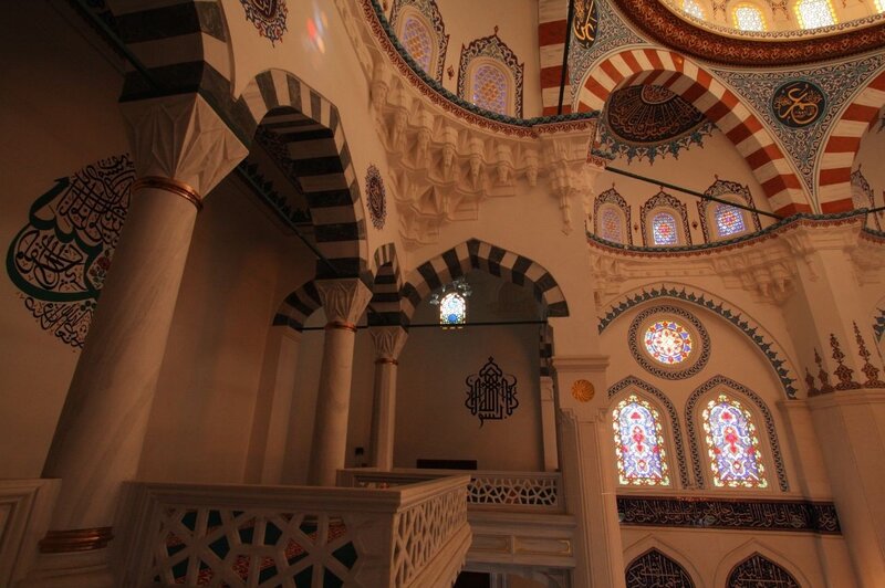 Interior of a mosque with stained glass