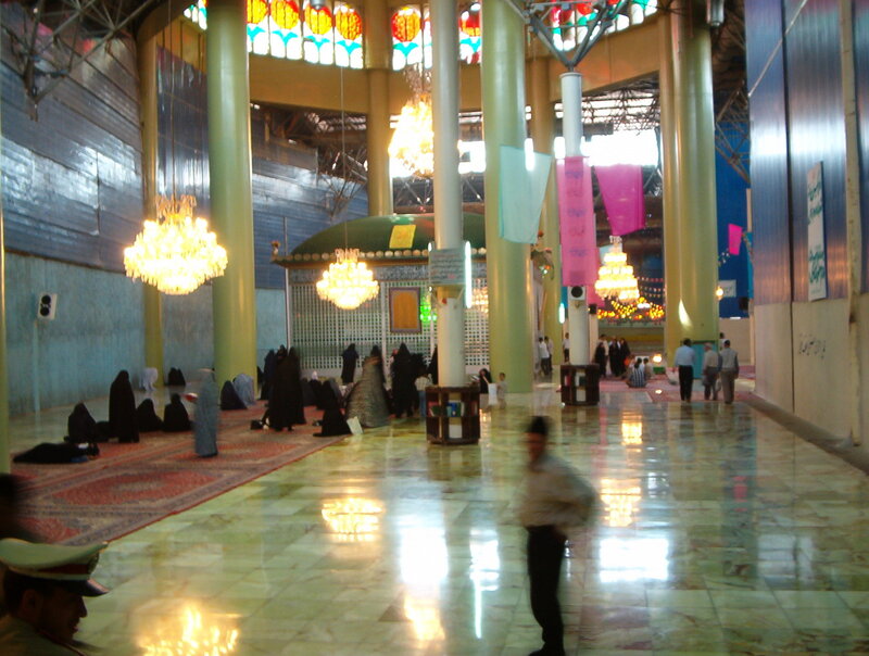 Interior of a mosque with worshippers