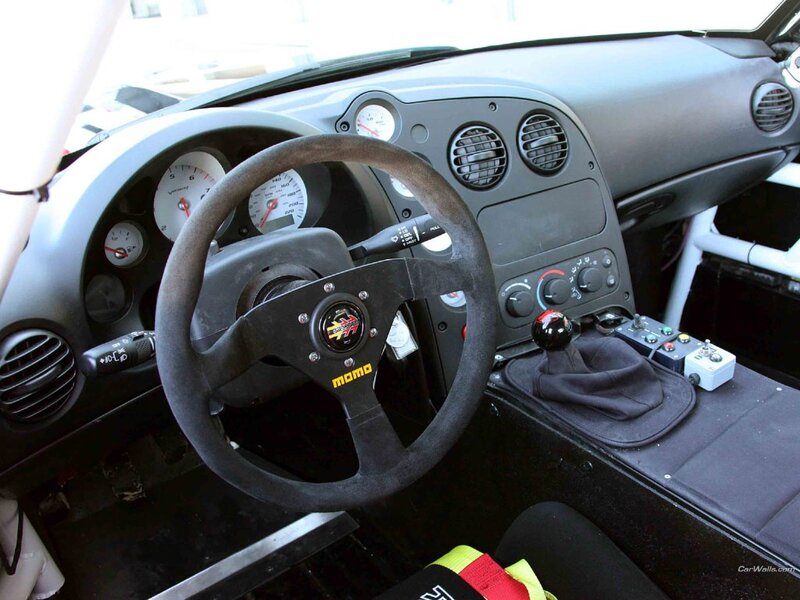 Interior of a Race Car — Black, Functional, Photograph, Steering Wheel, Dashboard, Gear Shift