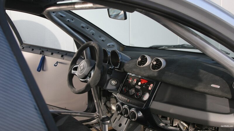 Interior of a Race Car — Black, Functional, Photograph, Steering Wheel, Dashboard