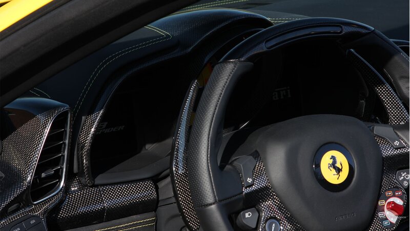 Interior of a Sports Car — Black, Dramatic, Photograph, Steering Wheel, Carbon Fiber