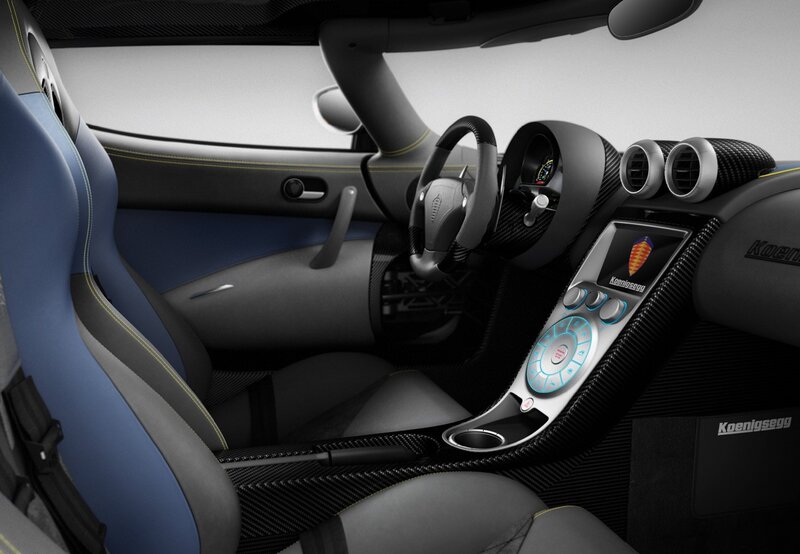 Interior of a Sports Car — Black, Sleek, Modern, Photograph, Steering Wheel, Dashboard, Carbon Fiber