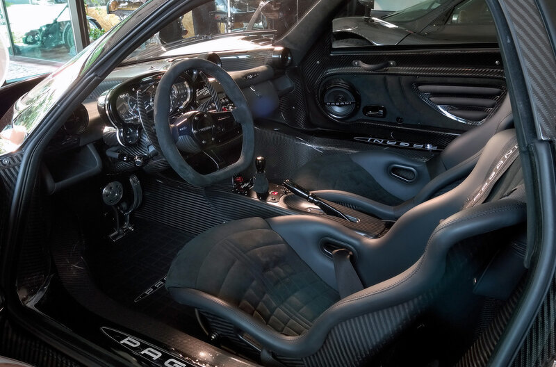 Interior of a Sports Car — Black, Sleek, Photograph, Steering Wheel, Carbon Fiber