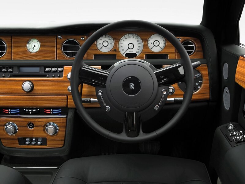Interior of Luxury Car — Black, Luxurious, Photograph, Steering Wheel, Dashboard, Wood Trim, Brown, Silver
