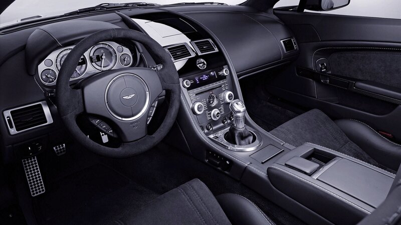 Interior of Luxury Car — Black, Sleek, Photograph, Steering Wheel, Center Console, Dashboard, Gray
