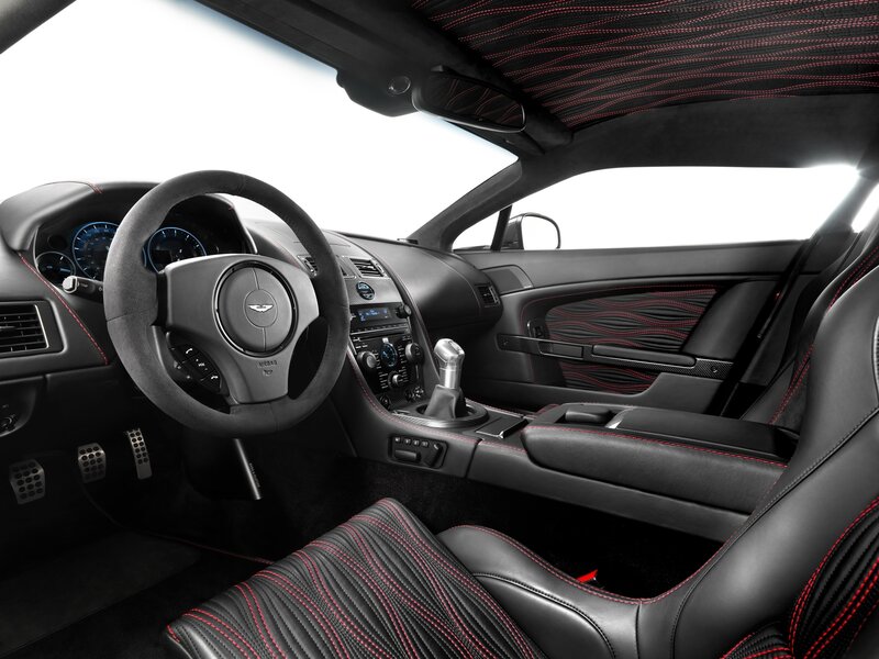 Interior of Luxury Car — Black, Sleek, Photograph, Steering Wheel, Center Console, Sport Seats