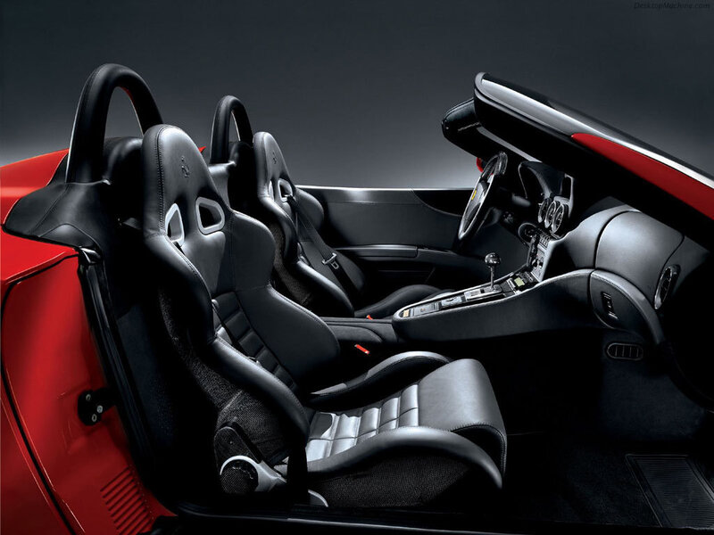 Interior of Red Sports Car — Dramatic, Photograph, Black Leather Seats, Steering Wheel