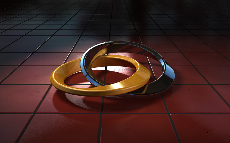 Interlocking Gold and Silver Rings — Dramatic