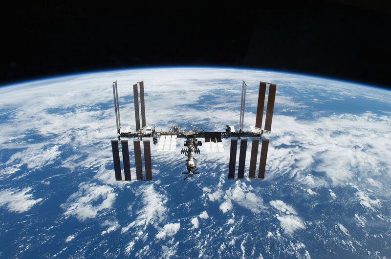International Space Station — Blue, Serene, Photograph, Earth, Clouds, Solar Panels, White
