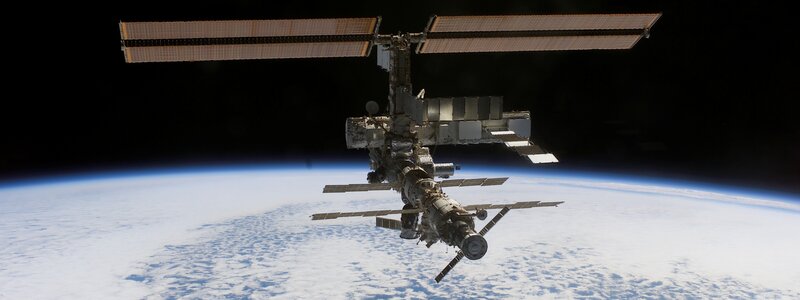 International Space Station — Blue, Serene, Photograph, Earth, Solar Panels, White
