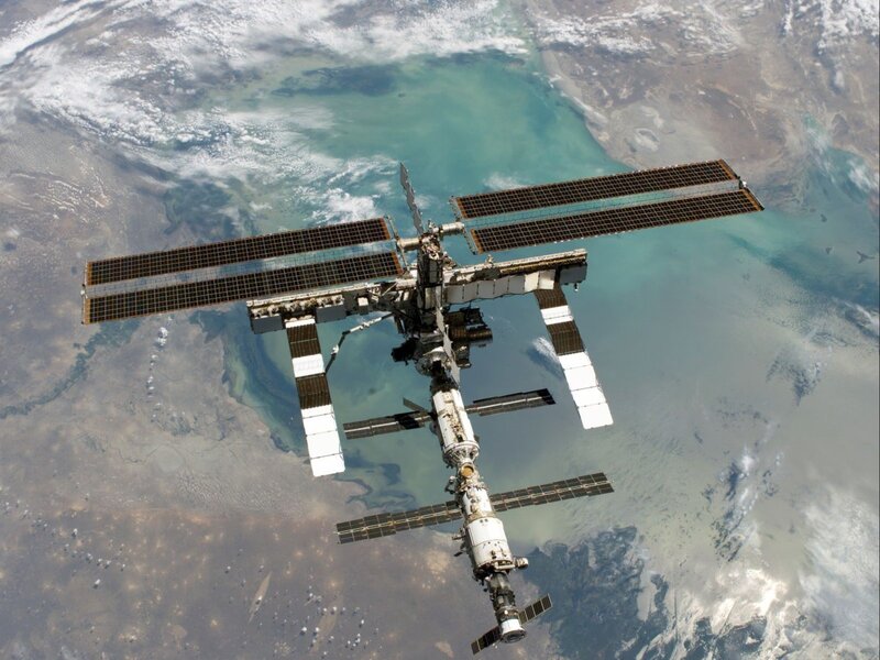 International Space Station — White, Serene, Photograph, Solar Panels, Earth, Ocean