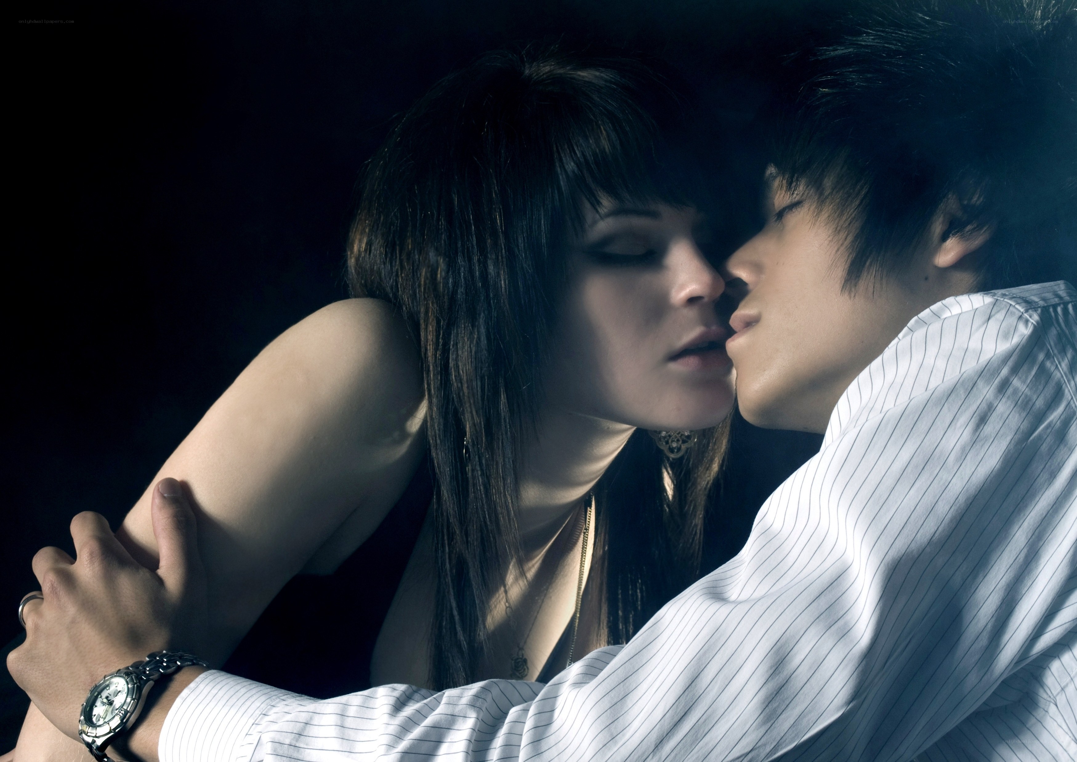 intimate couple in dark setting