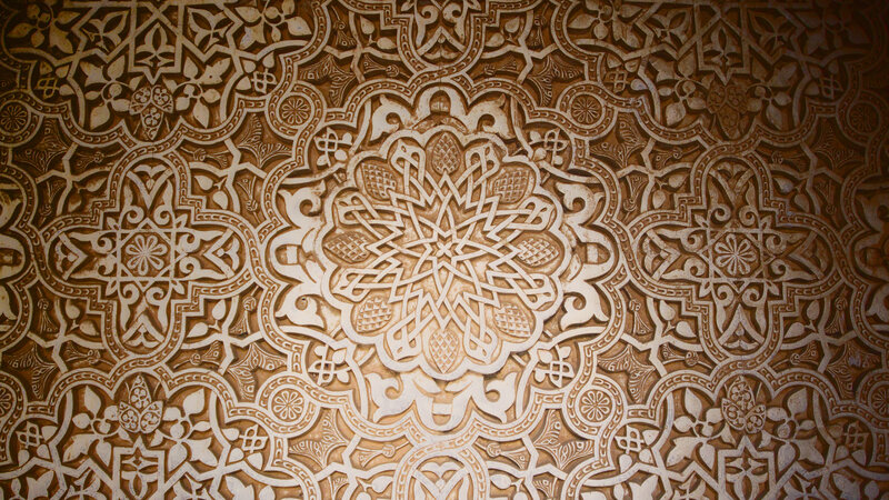 intricate arabesque wall carving