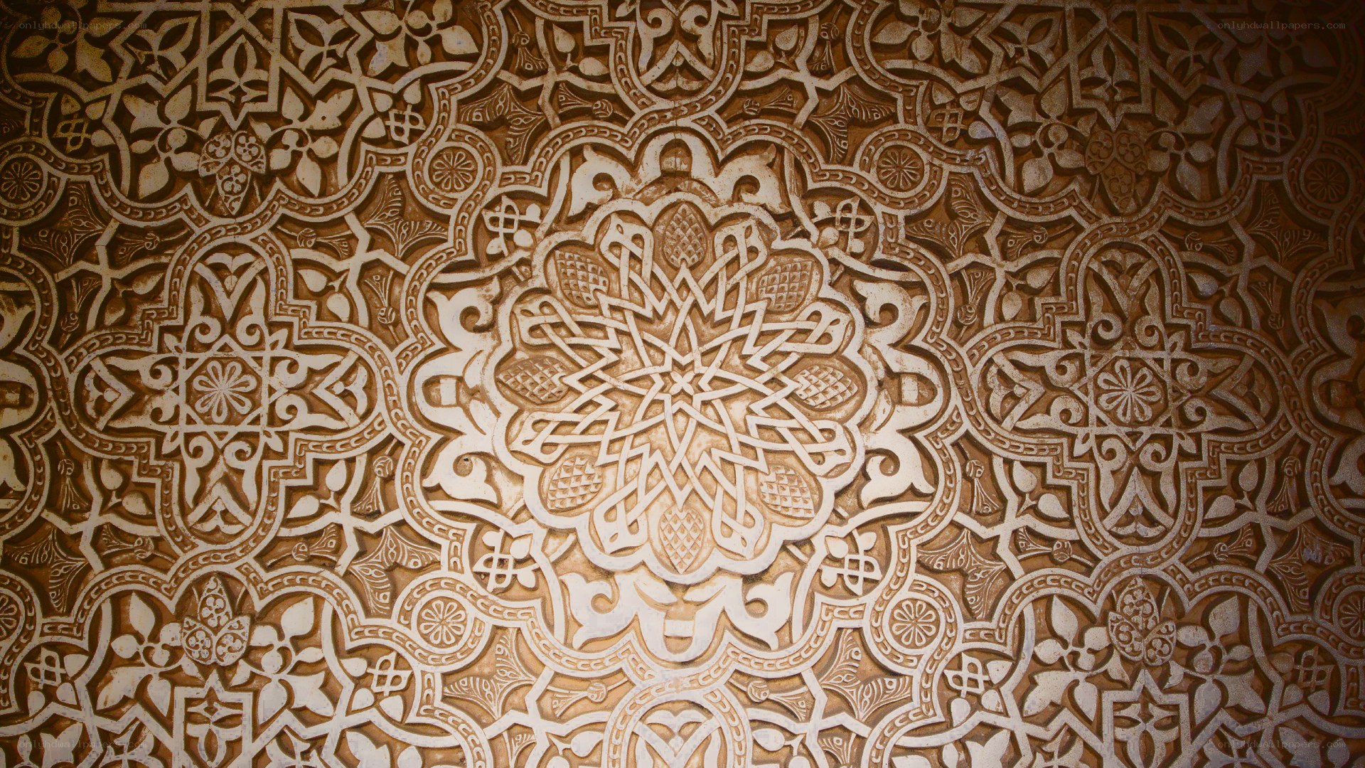 intricate arabesque wall carving